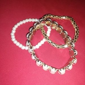 3 stretchy gold and pearl looking bracelets